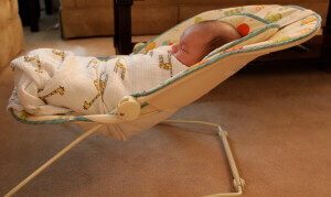 Baby in bouncing recliner seat